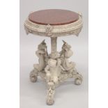 A 19TH CENTURY CARVED AND PAINTED WOOD CENTRE TABLE, the ornate base covered with three cherubic