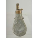 A GOOD SMALL COPPER POWDER FLASK repousse with a man holding a rabbit. 6ins long dinted.