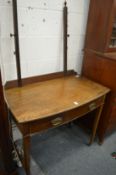 A mahogany bow fronted side table or dressing table.