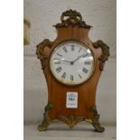 A small mantel clock.