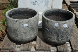 A pair of composite garden planters.