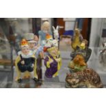 A collection of Doulton, Beswick and other porcelain figures relating to Alice in Wonderland.