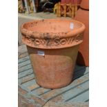 A large terracotta plant pot.