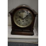 An oak mantel clock.
