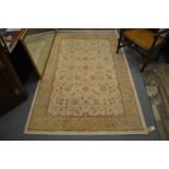 An Indian rug, cream ground with floral decoration 200cm x 133cm.