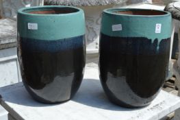 A pair of glazed garden planters.