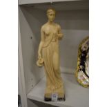 A model of a classical female figure.
