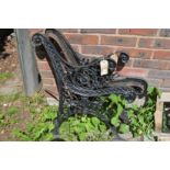 A pair of cast iron bench ends.