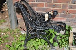 A pair of cast iron bench ends.