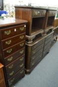 A mahogany bedroom suite comprising a semainier, pair of bedside tables and a large eight drawer