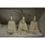 A group of four unusual white glazed pottery figures of musicians.