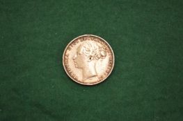 A Victorian Young Head gold sovereign dated 1880.