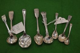 Seven various mustard spoons etc.