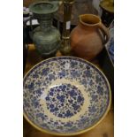 A large blue and white bowl, jug, vase and brass lamp base.