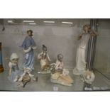 A collection of Lladro and Neo figures.