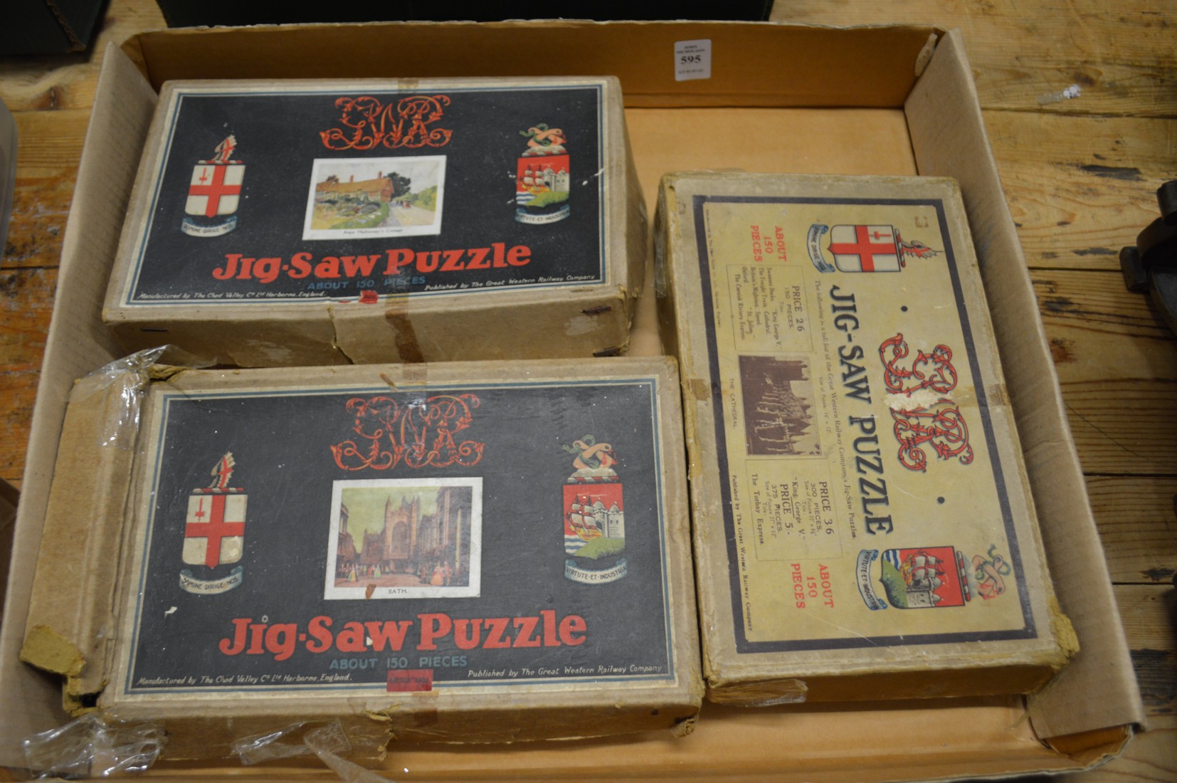 Three early jigsaw puzzles.