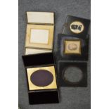 Leather folding photograph frames, a silhouette and other items.