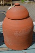 A terracotta rhubarb forcer with cover.