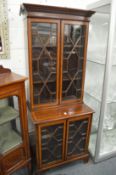 An Edwardian inlaid mahogany four door display cabinet.