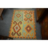 A colourful Kilim rug 125cm x 90cm.