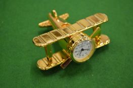 A novelty biplane bedside clock.