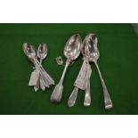 A set of silver teaspoons London 1902 and four various dessert spoons.