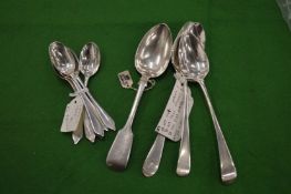 A set of silver teaspoons London 1902 and four various dessert spoons.