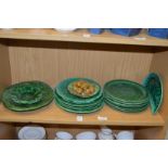 Cabbage leaf plates and a Palissy style dish of walnuts.
