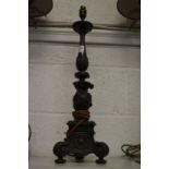 A bronze classical style lamp base.