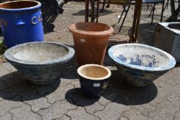 Four various garden planters.