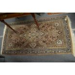 A Persian design rug 180cm x 95cm.