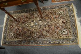 A Persian design rug 180cm x 95cm.