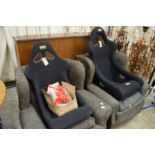 A pair of OMP car racing seats with harnesses, appear unused.