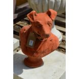 A terracotta garden ornament modelled as a bust of a dog.