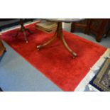 A Chinese red ground carpet 250cm x 150cm.