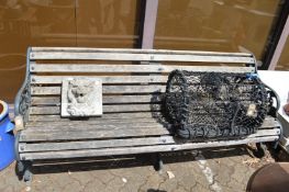 A good cast iron and wooden slatted garden bench.