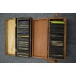 Two boxes containing early photographic slides.