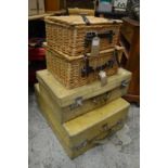 Wicker hampers and vellum suitcases.