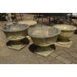 Two pairs of pedestal garden planters.