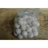 A bag of Titleist golf balls.