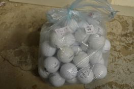 A bag of Titleist golf balls.
