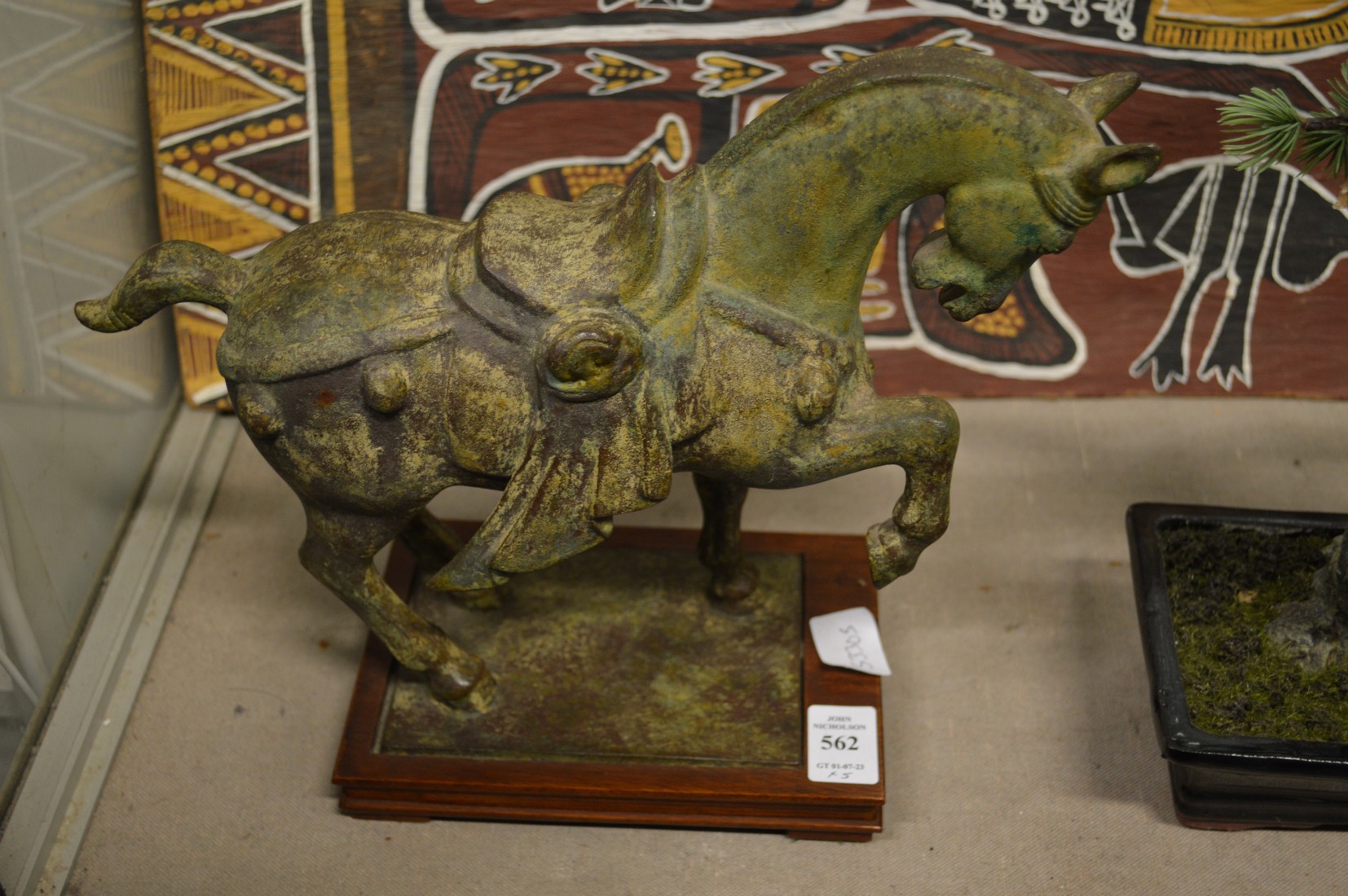 A bronze Tang style horse and other Oriental collectables.