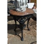 A cast iron and wooden pub table.