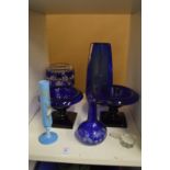 Blue glass pedestal salts and other items.