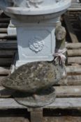 A composite garden model of a goose.