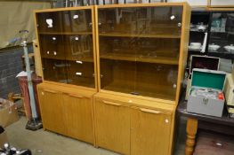 A pair of oak office storage cabinets.