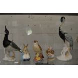 Two Continental porcelain models of birds, a Royal Worcester porcelain model of a thrush and two