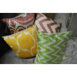 Decorative silk and feather filled cushions.