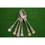 Six silver dessert spoons.