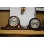 Two mantel clocks.